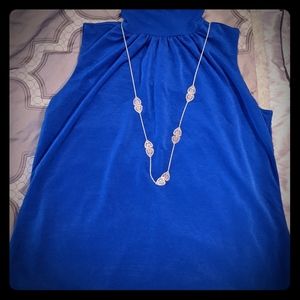 Blue turtleneck no sleeve blouse